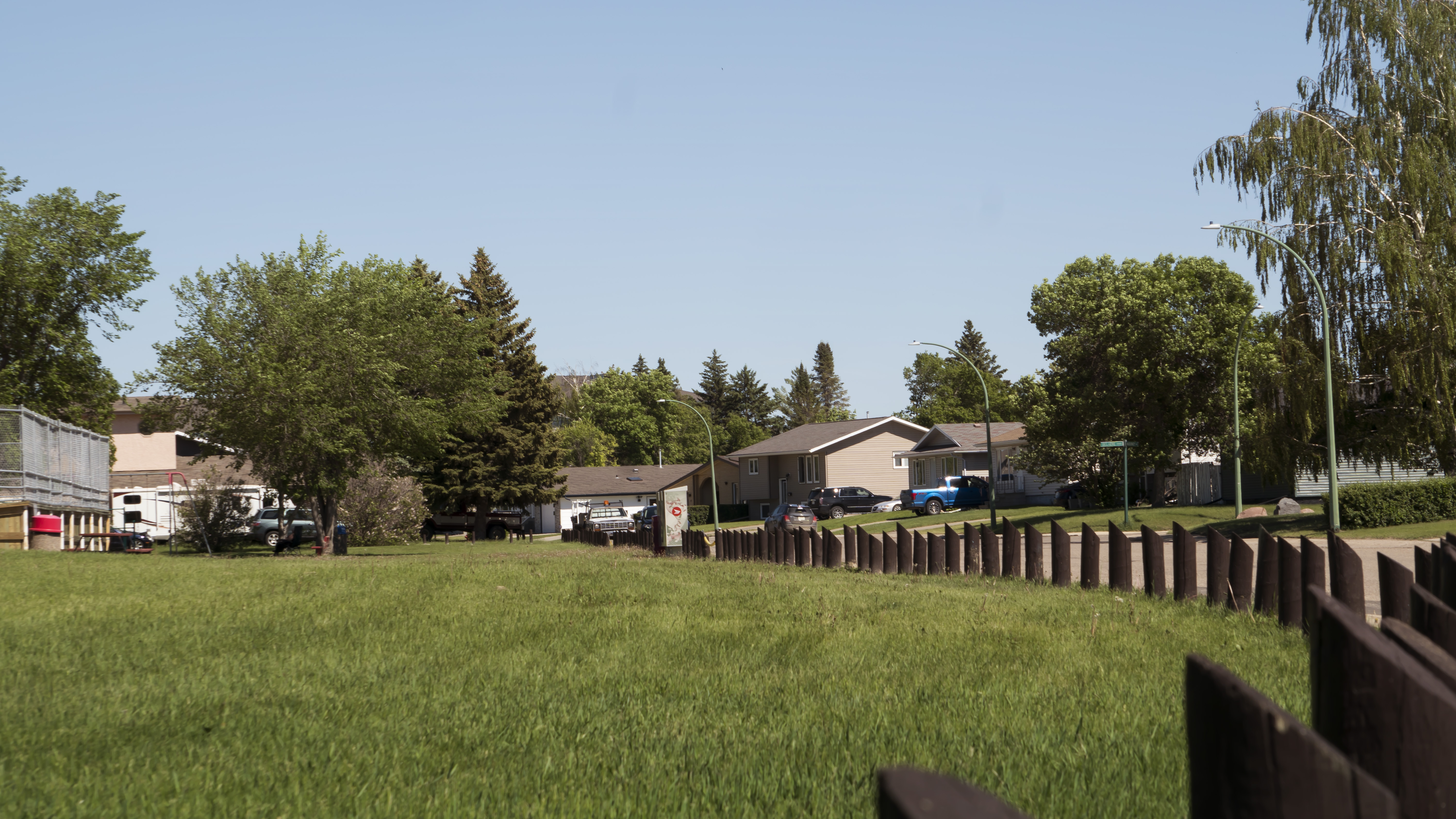 A photo taken in summer of the grassy space in Heritage Heights Park.